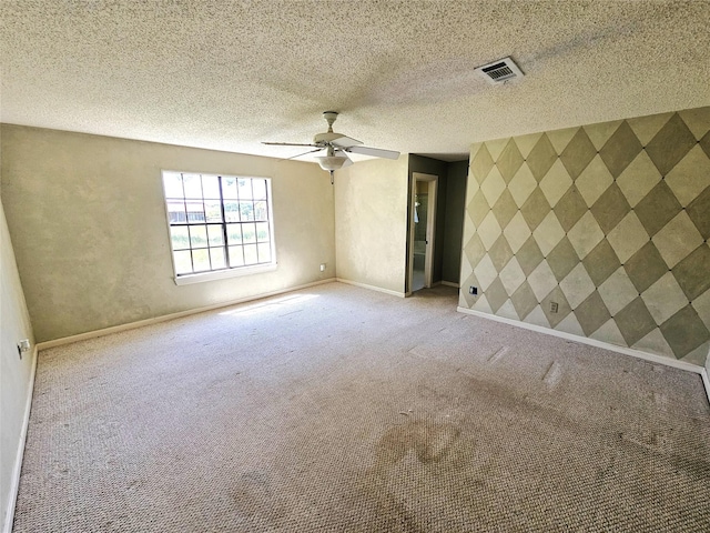 338 Lcr 866, Donie, TX 75838 - carpeted spare room with baseboards, a ceiling fan, and an accent wall