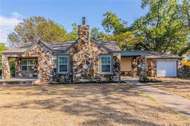 2400 Ethel Ave, Waco, TX 76707 - view of front of house with stone siding, a chimney, and a garage