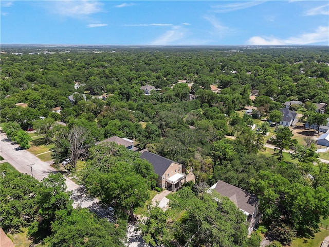 birds eye view of property with a forest view