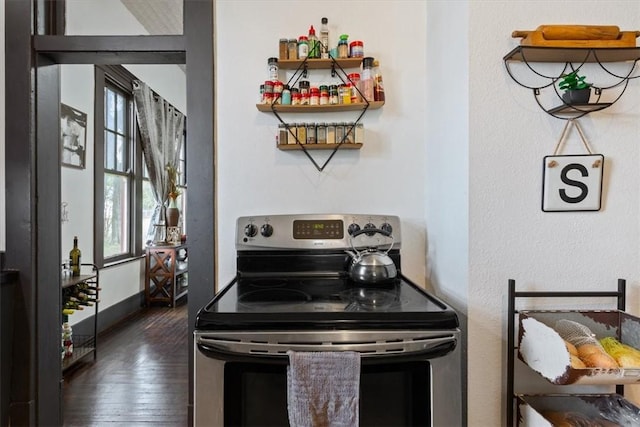 506 E Frederick St, Riesel, TX 76682 - kitchen with open shelves, electric range, baseboards, and dark wood-type flooring