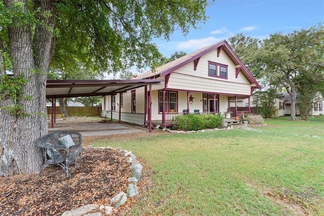 506 E Frederick St, Riesel, TX 76682 - farmhouse with covered porch, an attached carport, a front yard, and fence