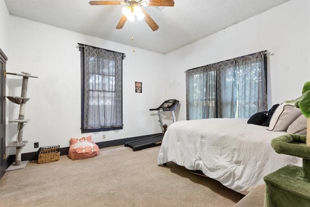 506 E Frederick St, Riesel, TX 76682 - carpeted bedroom featuring a textured ceiling and a ceiling fan
