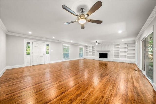 2901 Woodland Dr, Waco, TX 76710 - unfurnished living room with a healthy amount of sunlight, baseboards, and ornamental molding