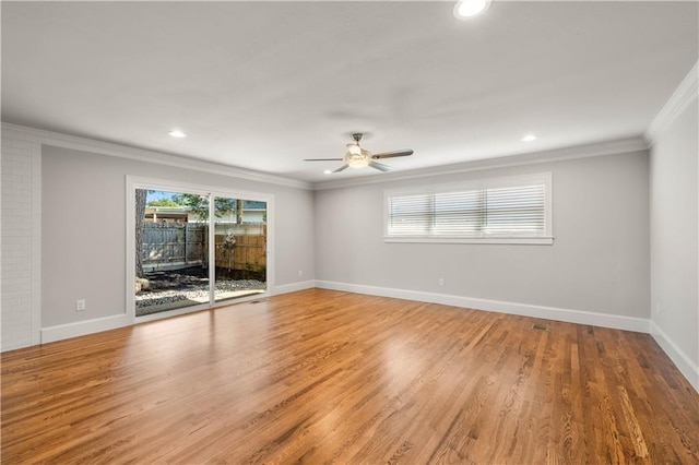 2901 Woodland Dr, Waco, TX 76710 - empty room featuring a wealth of natural light, light wood finished floors, a ceiling fan, and ornamental molding