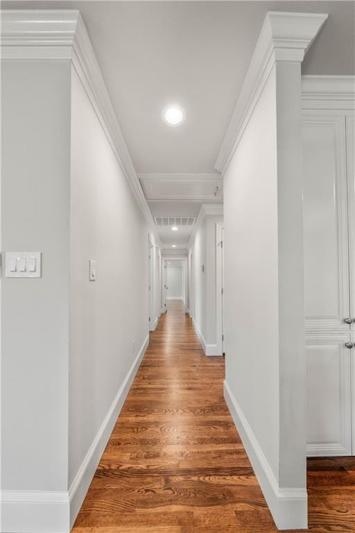 2901 Woodland Dr, Waco, TX 76710 - hallway with attic access, crown molding, baseboards, and wood finished floors