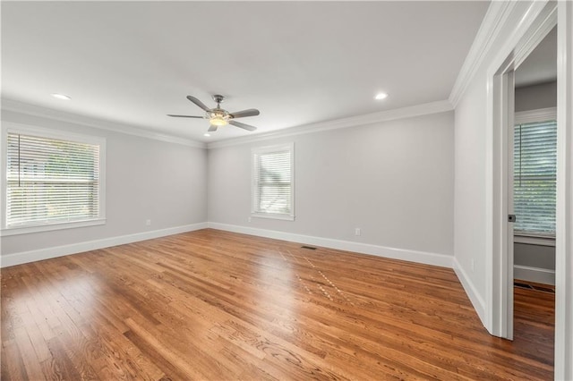 2901 Woodland Dr, Waco, TX 76710 - spare room with a ceiling fan, a healthy amount of sunlight, light wood-style flooring, and crown molding