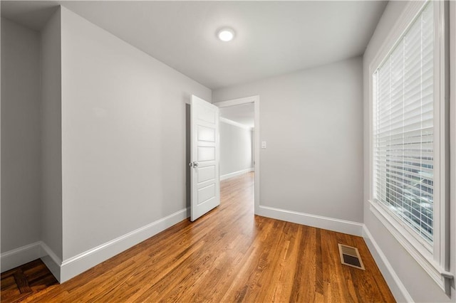 2901 Woodland Dr, Waco, TX 76710 - spare room with plenty of natural light, baseboards, visible vents, and light wood-type flooring