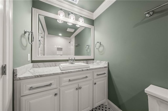 2901 Woodland Dr, Waco, TX 76710 - full bathroom with crown molding, baseboards, toilet, vanity, and a shower