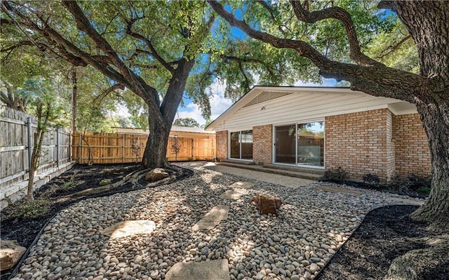 2901 Woodland Dr, Waco, TX 76710 - back of house with fence and brick siding