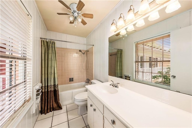 2901 Woodland Dr, Waco, TX 76710 - full bath featuring vanity, shower / bathtub combination with curtain, ceiling fan, tile patterned flooring, and toilet