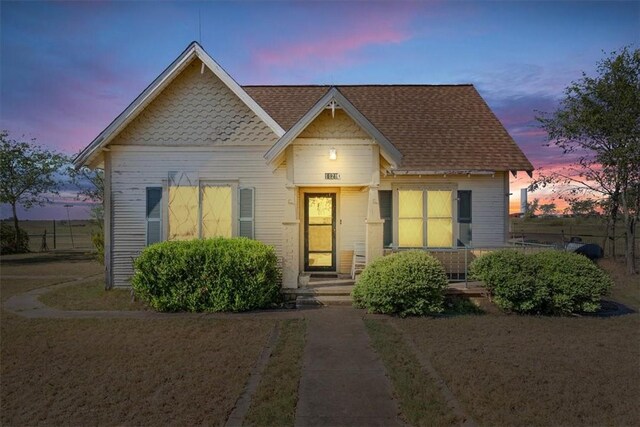 view of front of home with a shingled roof