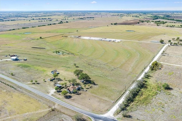 birds eye view of property with a rural view