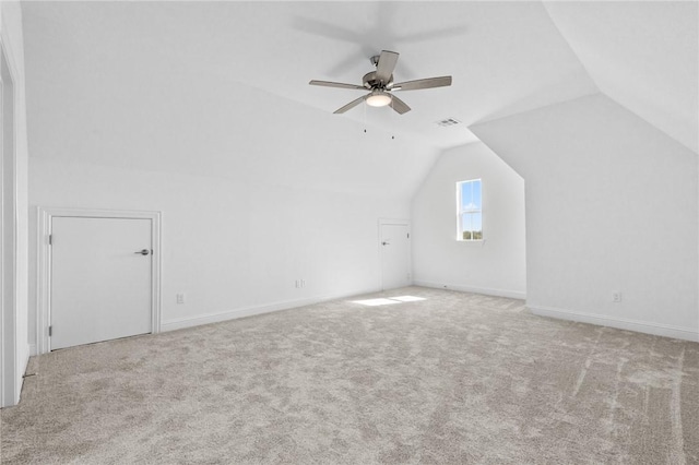 bonus room with lofted ceiling, carpet flooring, visible vents, and ceiling fan