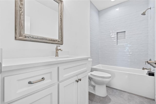 bathroom featuring vanity, bathing tub / shower combination, toilet, and tile patterned flooring