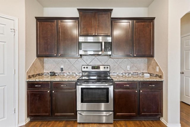 2820 Keathley Dr, Lorena, TX 76655 - kitchen with dark wood finished floors, dark brown cabinetry, light stone countertops, and appliances with stainless steel finishes