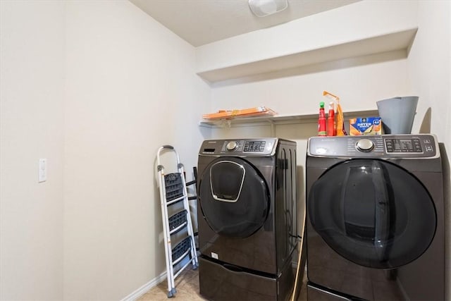 2820 Keathley Dr, Lorena, TX 76655 - laundry room with washing machine and clothes dryer, laundry area, baseboards, and light tile patterned floors