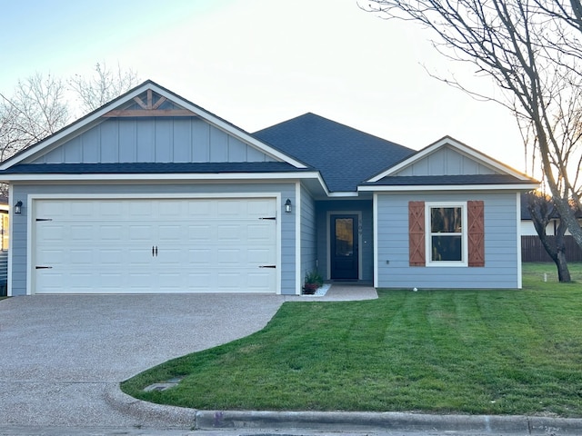 509 Mckinley St, Mcgregor, TX 76657 - ranch-style house with driveway, a front yard, a garage, board and batten siding, and a shingled roof