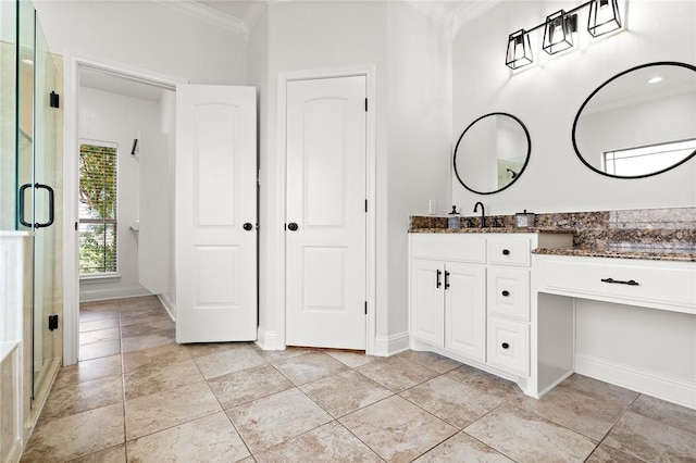 3243 N Lone Star Pkwy, Mcgregor, TX 76657 - full bathroom with a stall shower, vanity, baseboards, and ornamental molding