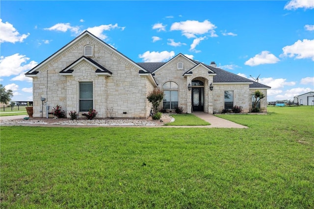 3243 N Lone Star Pkwy, Mcgregor, TX 76657 - french country inspired facade featuring a front yard, stone siding, and a shingled roof