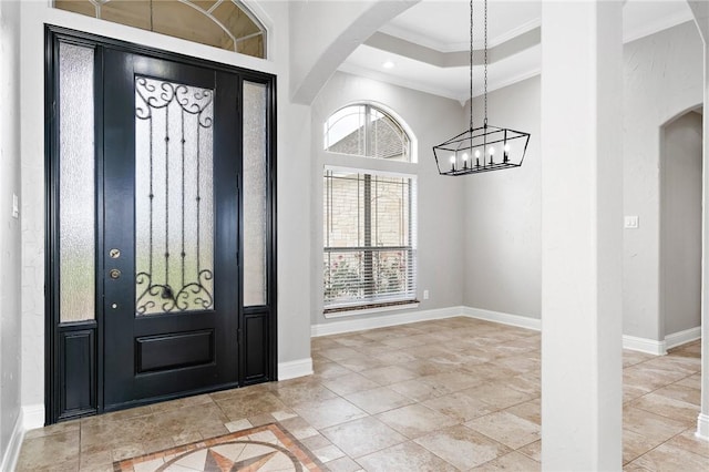 3243 N Lone Star Pkwy, Mcgregor, TX 76657 - entrance foyer featuring crown molding, plenty of natural light, baseboards, and arched walkways