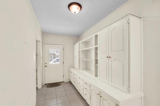 mudroom with light tile patterned flooring