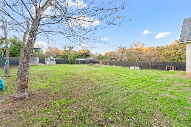 3103 Park Lake Dr, Waco, TX 76708 - rear view of house featuring roof with shingles, central air condition unit, brick siding, fence, and a yard
