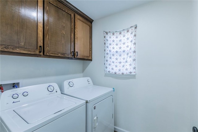 washroom featuring cabinet space and washing machine and dryer