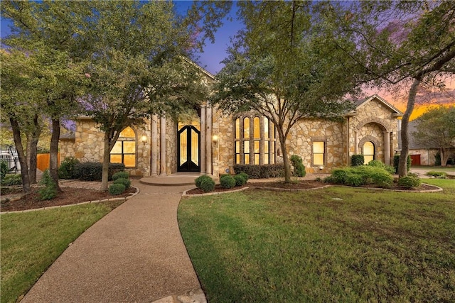 8460 Spicewood Springs Rd, China Spring, TX 76633 - view of front facade featuring stone siding and a front lawn