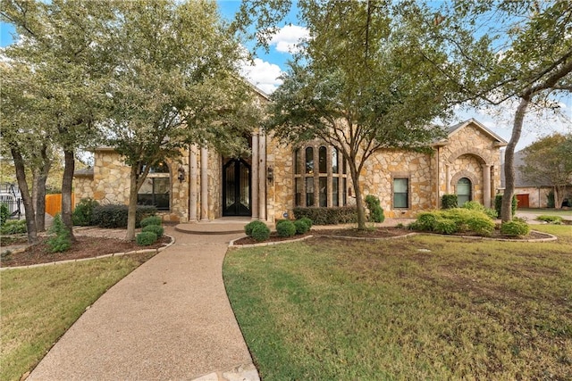 8460 Spicewood Springs Rd, China Spring, TX 76633 - view of front facade with a front lawn and stone siding