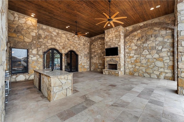 8460 Spicewood Springs Rd, China Spring, TX 76633 - view of patio with ceiling fan, a sink, and an outdoor stone fireplace