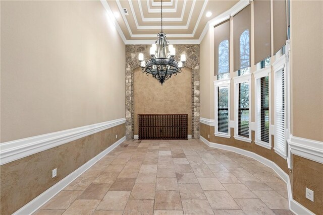8460 Spicewood Springs Rd, China Spring, TX 76633 - unfurnished dining area with a tray ceiling, an inviting chandelier, ornamental molding, and a towering ceiling