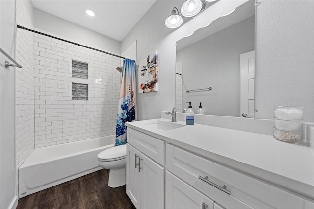 bathroom featuring shower / tub combo, toilet, wood finished floors, and vanity