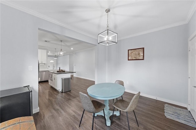 dining space featuring dark wood-style floors, baseboards, and ornamental molding