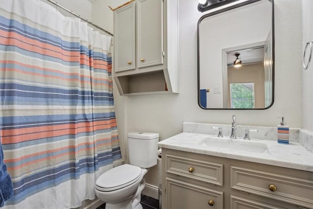 629 S 5th St, Waco, TX 76706 - bathroom featuring a shower with shower curtain, toilet, and vanity