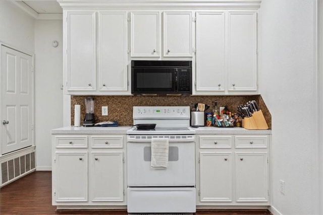 629 S 5th St, Waco, TX 76706 - kitchen with light countertops, visible vents, black microwave, and white range with electric cooktop