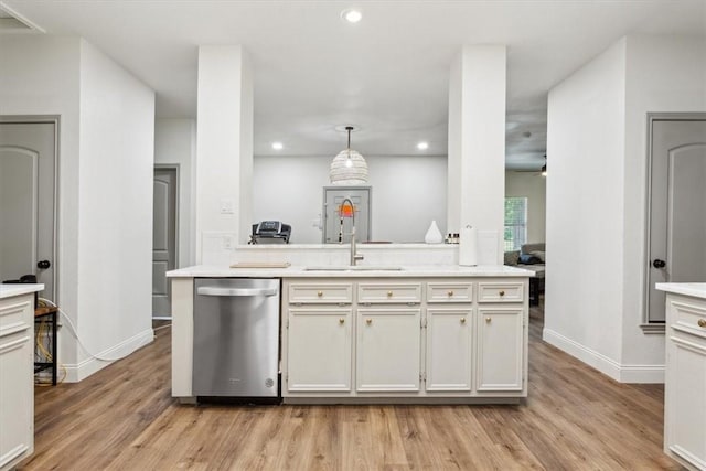 629 S 5th St, Waco, TX 76706 - kitchen with light wood-type flooring, light countertops, recessed lighting, stainless steel dishwasher, and a sink