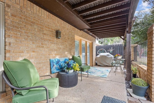 view of patio with fence and grilling area