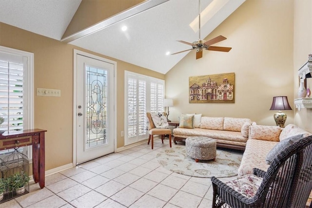 living area featuring high vaulted ceiling, light tile patterned floors, baseboards, and ceiling fan
