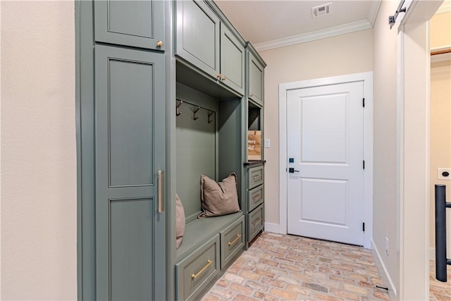 mudroom with brick floor, visible vents, baseboards, and ornamental molding