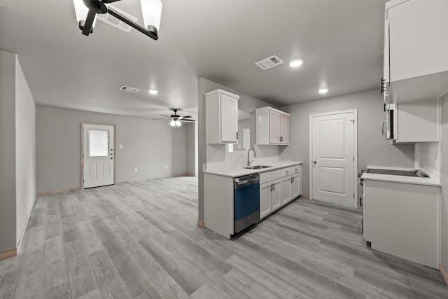 kitchen with visible vents, dishwashing machine, ceiling fan, light countertops, and a sink