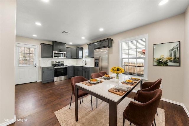 2713 Woodrow St, Waco, TX 76708 - dining room featuring dark wood-type flooring, recessed lighting, and baseboards