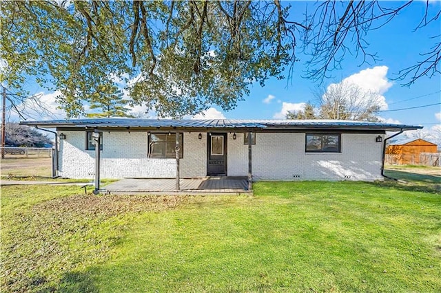 2386 Flat Rock Rd, Waco, TX 76708 - rear view of property featuring a lawn, brick siding, and fence