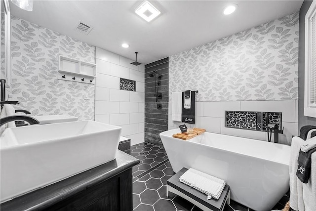 2386 Flat Rock Rd, Waco, TX 76708 - full bath with wallpapered walls, a sink, a walk in shower, tile walls, and tile patterned floors