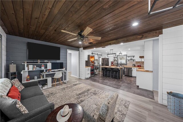 2386 Flat Rock Rd, Waco, TX 76708 - living area featuring recessed lighting, a barn door, light wood-style floors, wooden ceiling, and ceiling fan