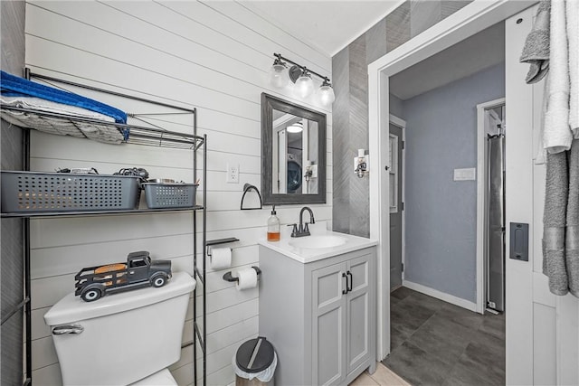 2386 Flat Rock Rd, Waco, TX 76708 - bathroom with wooden walls, toilet, vanity, and baseboards