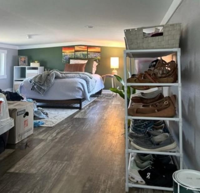 bedroom with wood finished floors