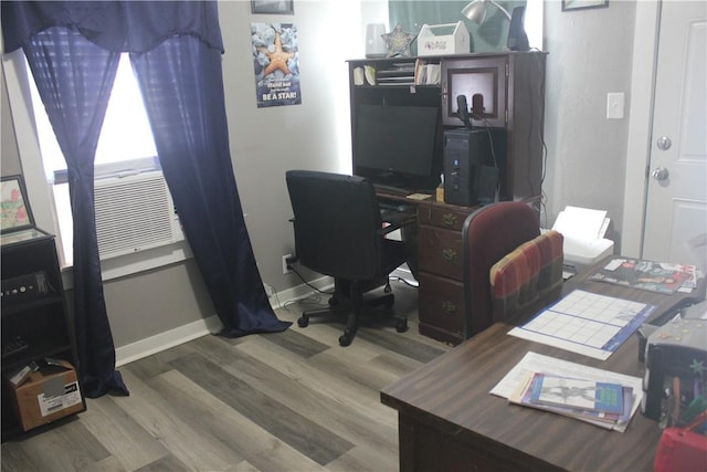 office area featuring baseboards and wood finished floors