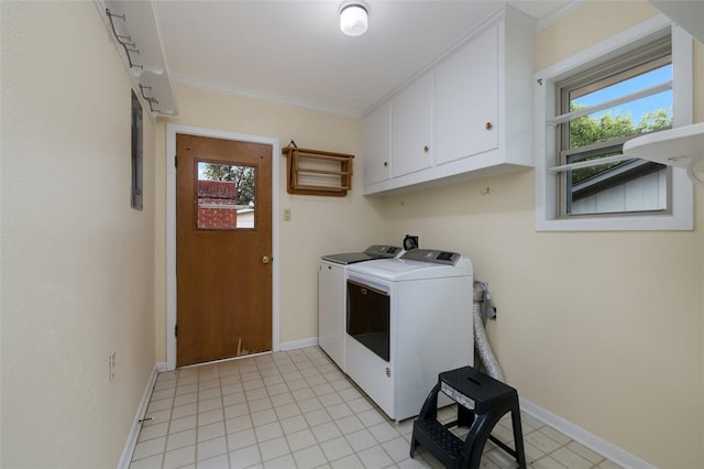 clothes washing area with washer and dryer, baseboards, cabinet space, and ornamental molding