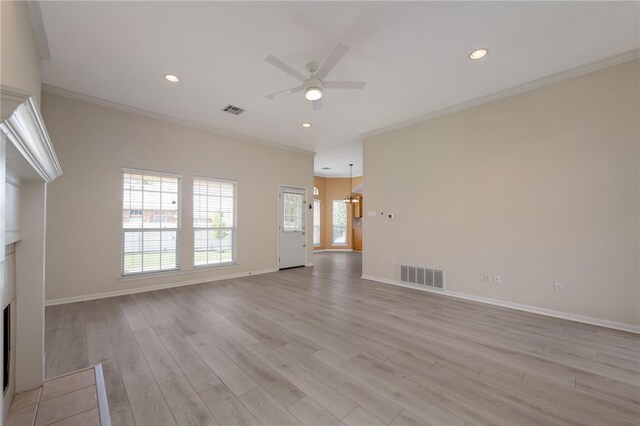 1110 Springhill St, Waco, TX 76705 - unfurnished living room featuring visible vents, crown molding, light wood-style floors, and a ceiling fan