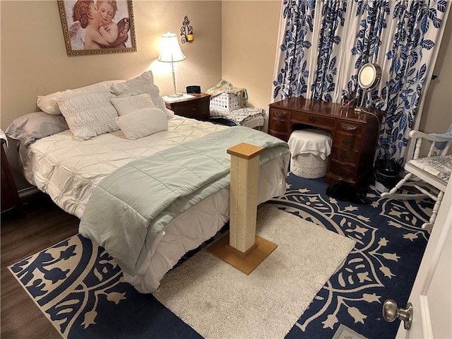 bedroom featuring wood finished floors